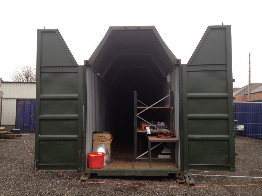 A shipping container modified into portable helicopter hangar.